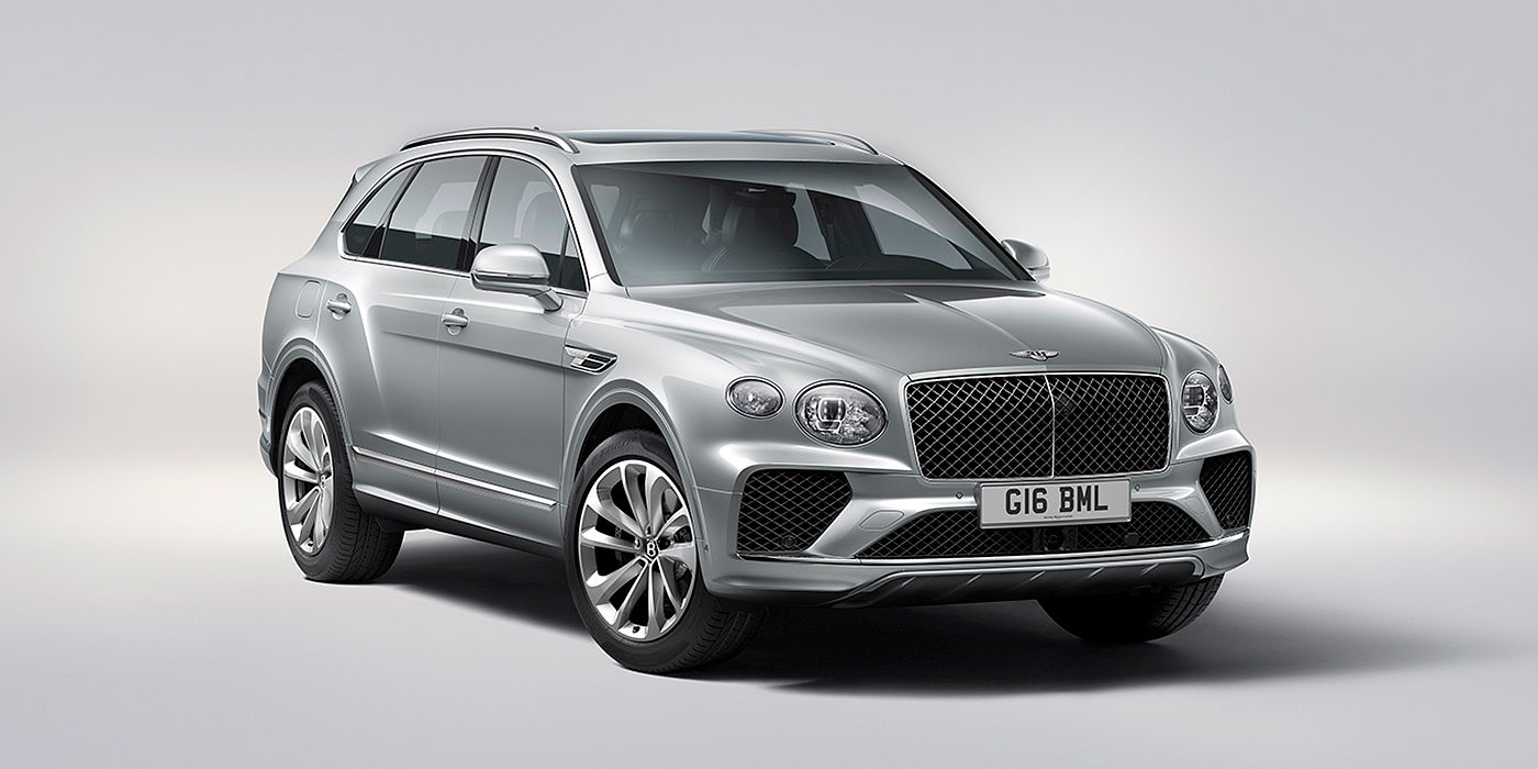 Bentley Shanghai - Pudong Bentley Bentayga in Moonbeam paint, front three-quarter view, featuring a matrix grille and elliptical LED headlights.