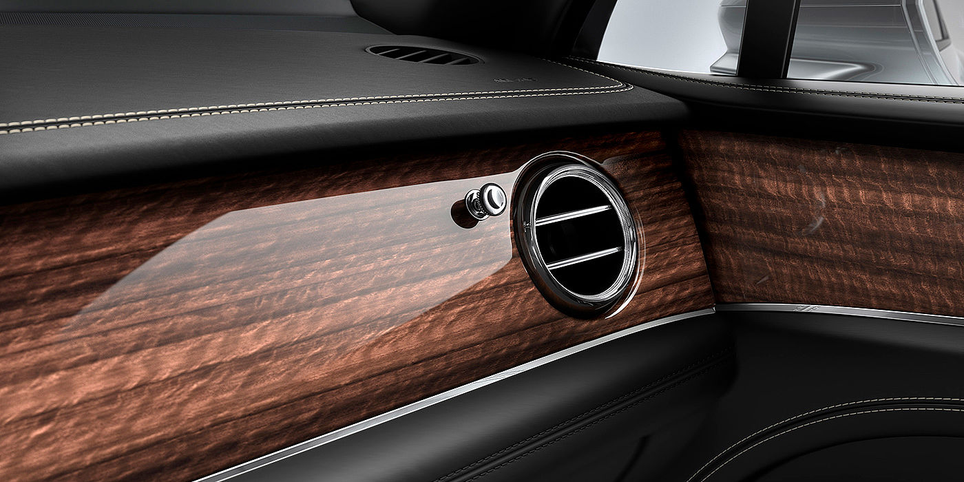 Bentley Shanghai - Pudong Bentley Bentayga front interior Crown Cut Walnut veneer and chrome air vent.